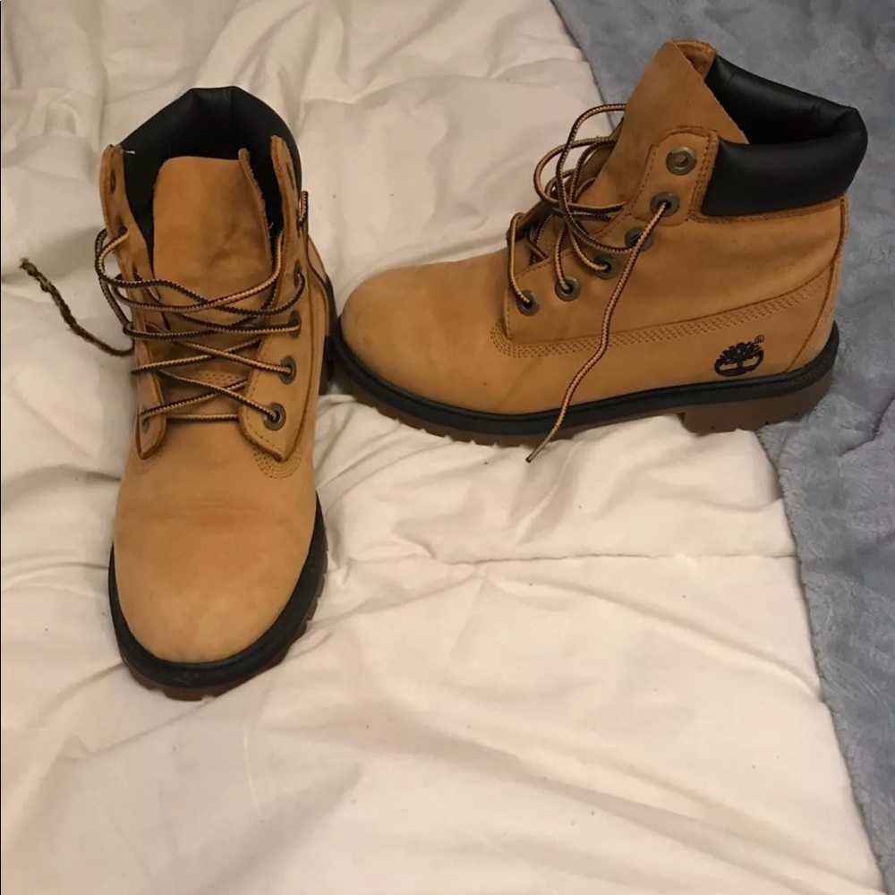 tan and black boys timberlands